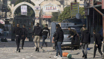 Palestinians say Israeli troops kill 9 in West Bank raid