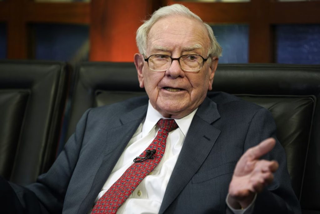 Buffett steps down as Berkshire chairman, son Howard takes over