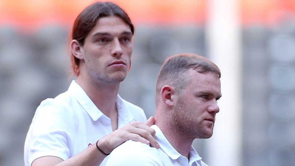 Wayne Rooney threatens legal action against Andy Carroll over book claims