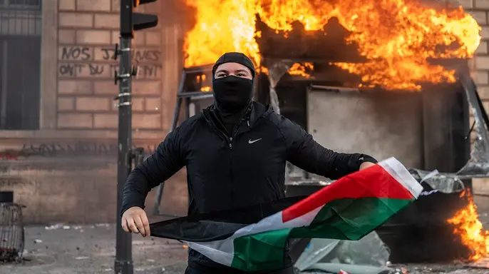 Hungary, Poland back strict migration rules as unrest rocks France